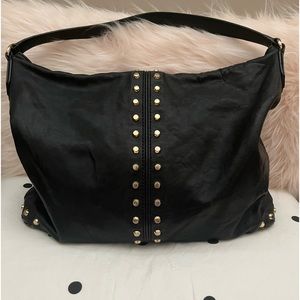 MK black and gold leather uptown Astor bag. In mint condition.